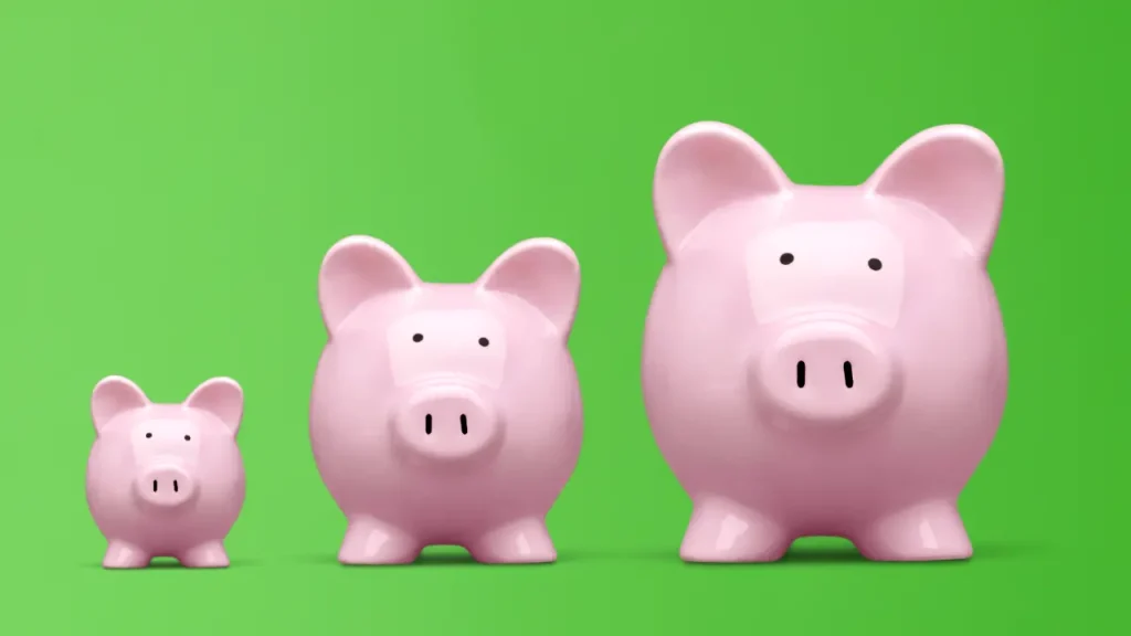 growing piggy bank, representing an annuity that you put your money into and watch it grow before it comes out. Three piggy banks, small, medium, and large, on a green background