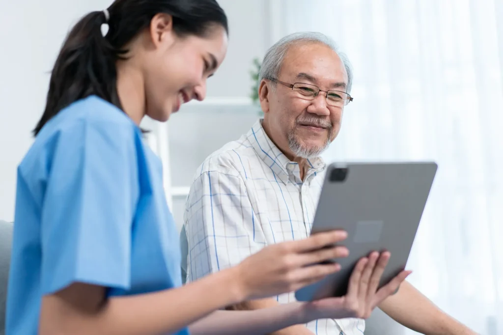 Nurse with patient, iPad screen, home health