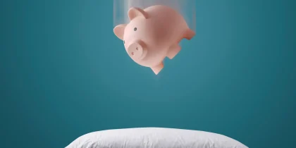 how to protect your financial investments and savings, piggy bank falling on a soft pillow