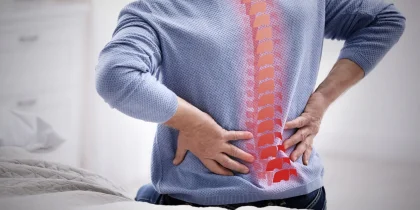 Senior man suffering from pain in back at home, closeup, sciatica